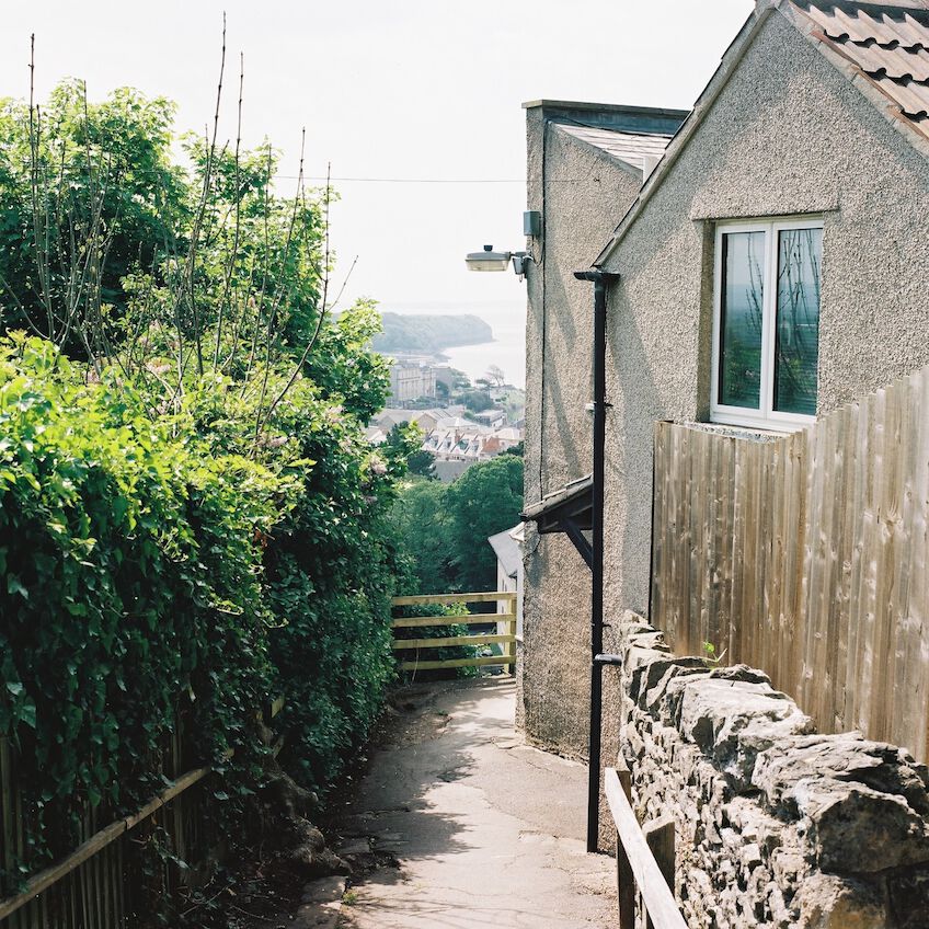 Small downhill alley with the sea in the background
