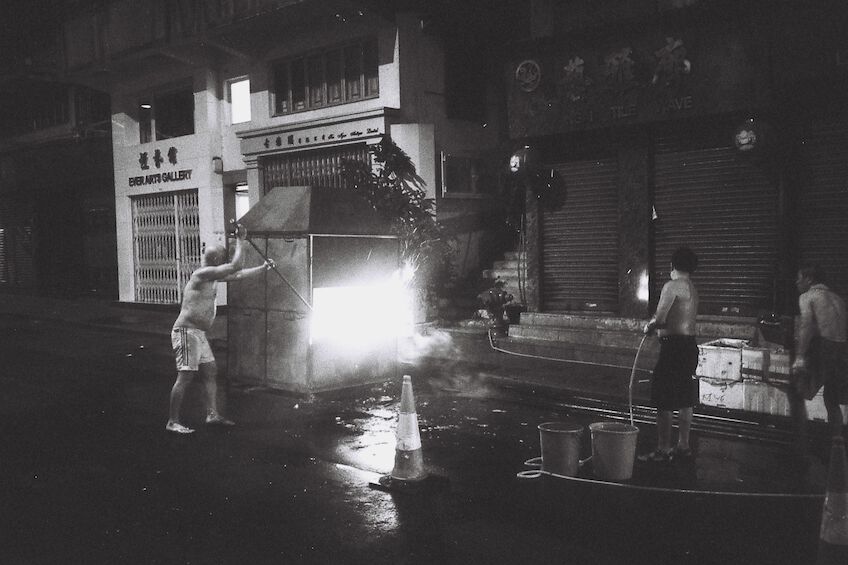 Men welding at night on the street